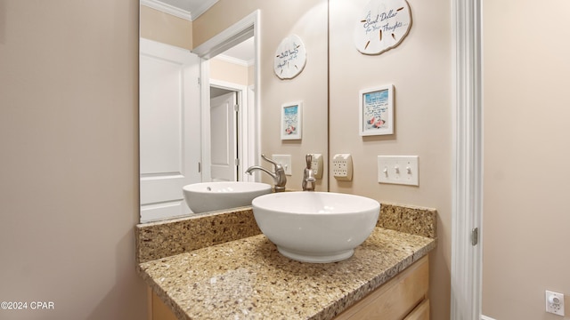 bathroom with vanity and crown molding