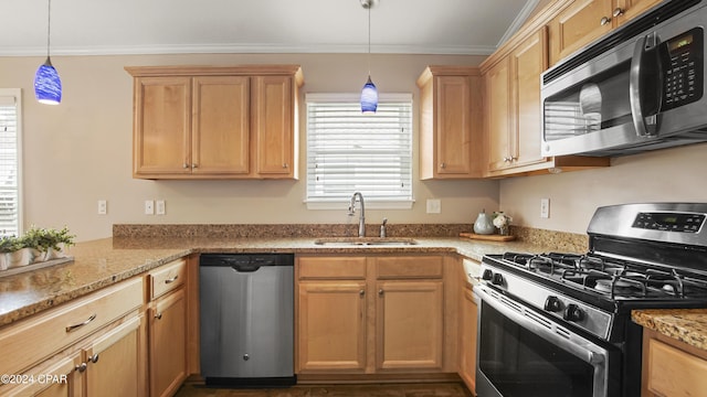 kitchen featuring pendant lighting, sink, ornamental molding, appliances with stainless steel finishes, and light stone counters