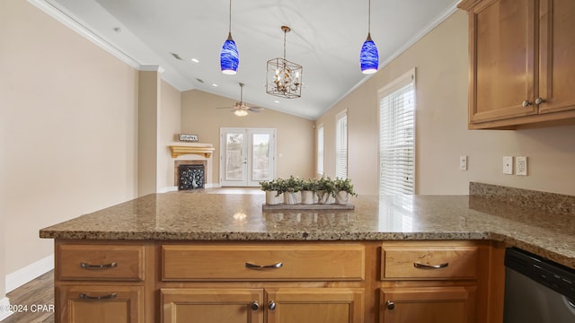 kitchen with dishwasher, ceiling fan with notable chandelier, stone countertops, and vaulted ceiling