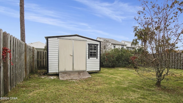 view of outbuilding featuring a lawn