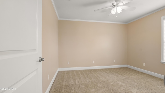 unfurnished room with carpet, ceiling fan, and ornamental molding