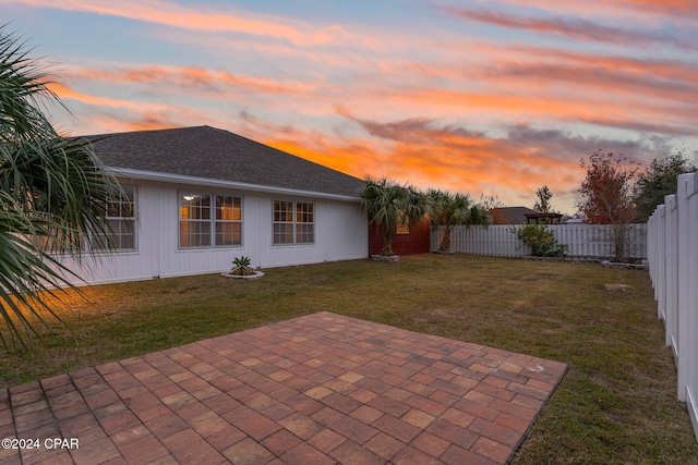 exterior space featuring a lawn and a patio