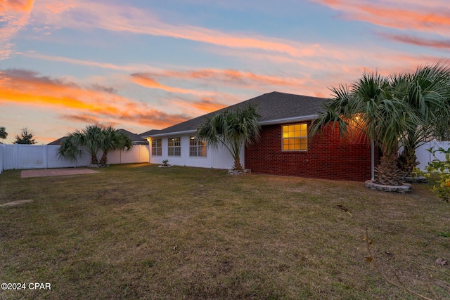 view of front of property with a yard