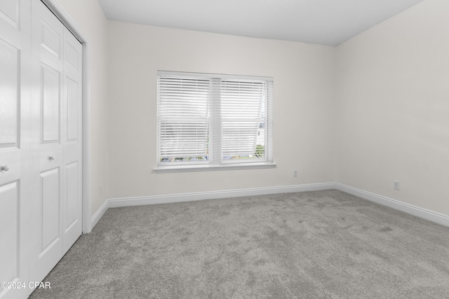 spare room with light carpet