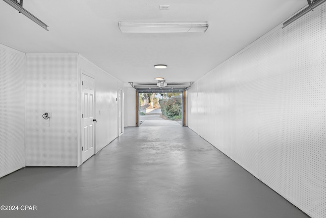 corridor with concrete flooring