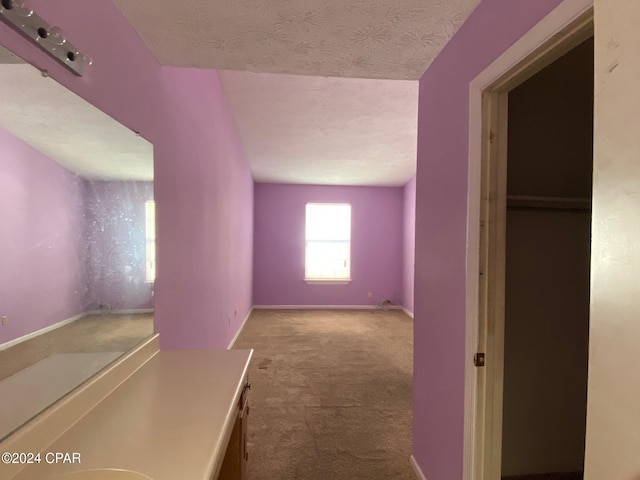 interior space featuring a textured ceiling