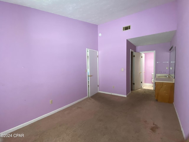 unfurnished bedroom featuring carpet