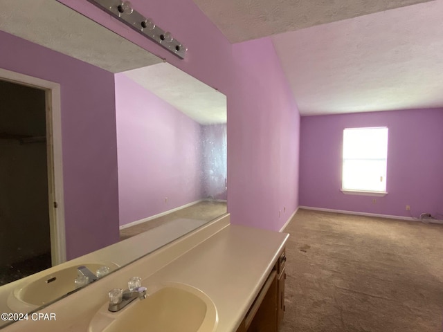 bathroom featuring vanity and a textured ceiling