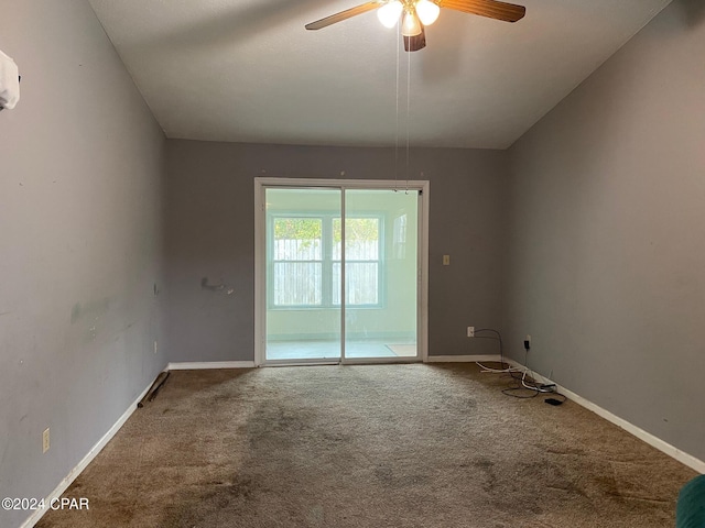 carpeted empty room featuring ceiling fan