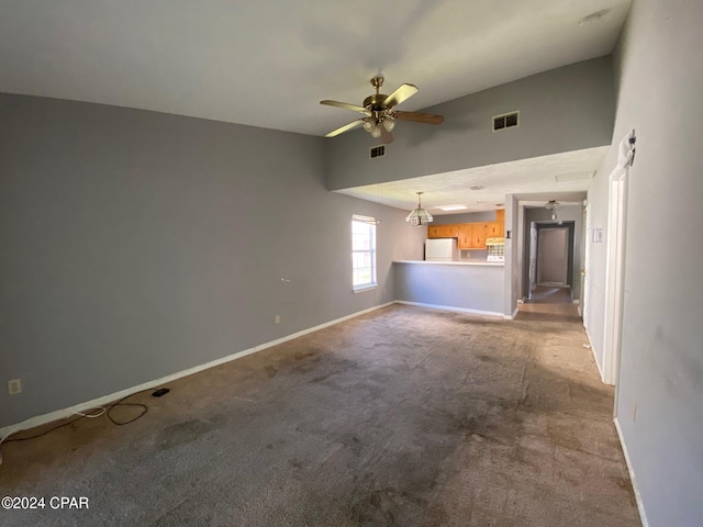 unfurnished living room with ceiling fan and light colored carpet