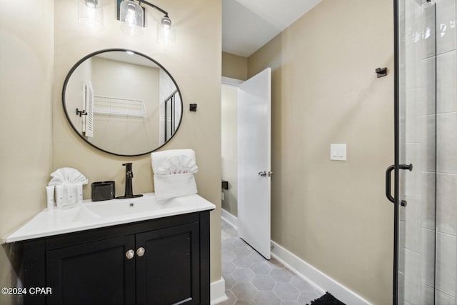 bathroom featuring tile patterned flooring, vanity, and walk in shower