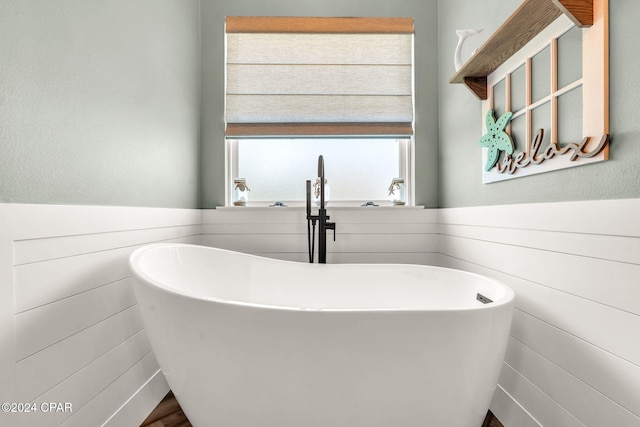 bathroom featuring a bath and sink