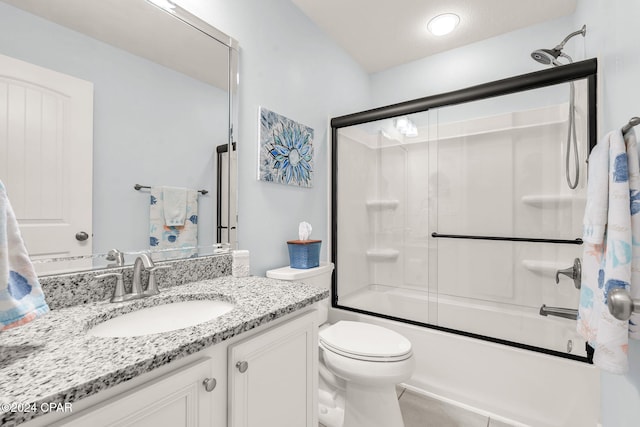 full bathroom with tile patterned flooring, vanity, toilet, and bath / shower combo with glass door