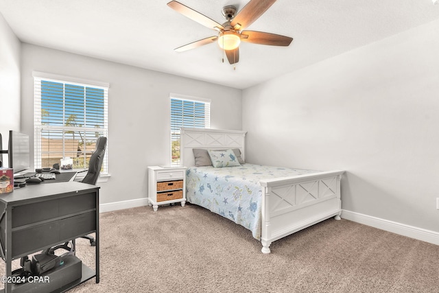 bedroom with ceiling fan and carpet floors