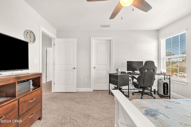 bedroom with ceiling fan and light colored carpet