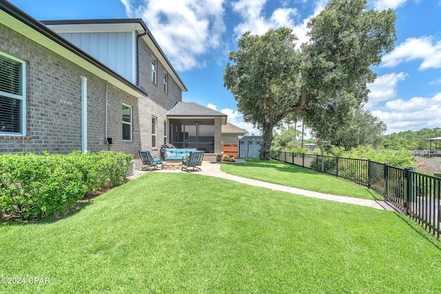 view of yard featuring outdoor lounge area, a patio, ceiling fan, and a sunroom