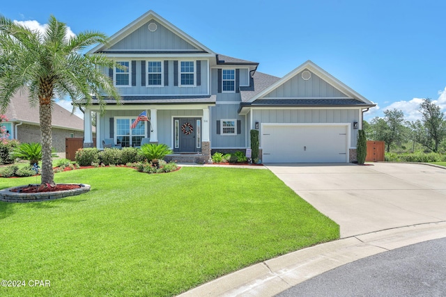 view of front facade featuring a front yard and a garage