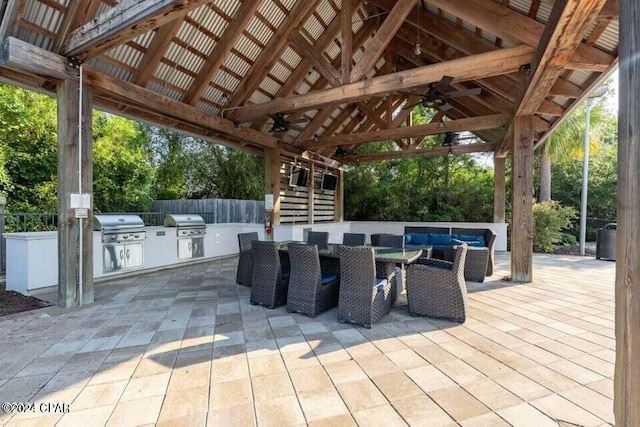 view of patio with a gazebo, an outdoor kitchen, and a grill