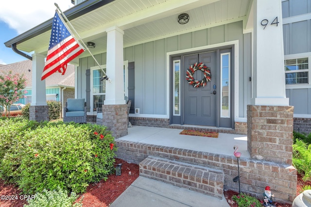 property entrance featuring covered porch