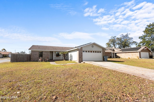 single story home featuring a garage and a front lawn