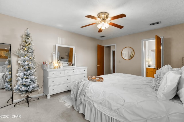 7707 Shadow Bay Dr, Panama City, FL 32404 - bedroom featuring connected bathroom, light colored carpet, and ceiling fan