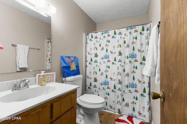 7707 Shadow Bay Dr, Panama City, FL 32404 - bathroom featuring toilet, wood-type flooring, a textured ceiling, vanity, and a shower with shower curtain