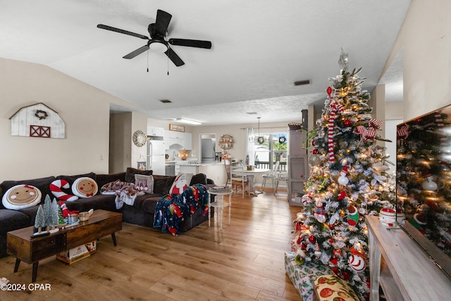 7707 Shadow Bay Dr, Panama City, FL 32404 - living room featuring lofted ceiling, light hardwood / wood-style floors, and ceiling fan