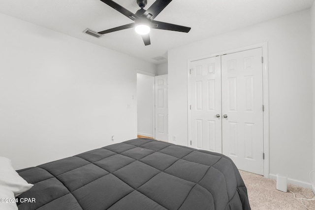 bedroom with carpet flooring, ceiling fan, and a closet