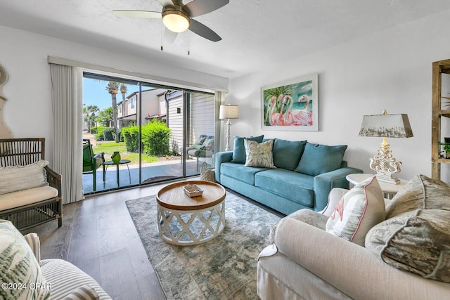 living room featuring ceiling fan and wood-type flooring