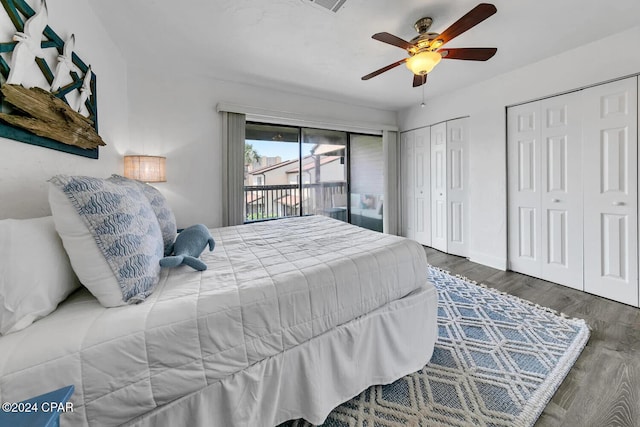 bedroom featuring access to outside, multiple closets, ceiling fan, and dark wood-type flooring