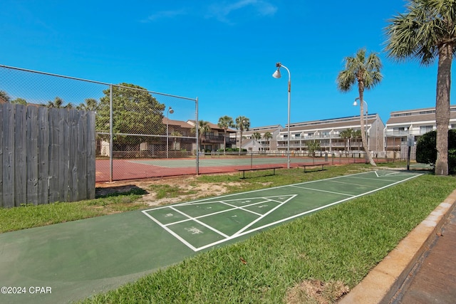 surrounding community featuring tennis court