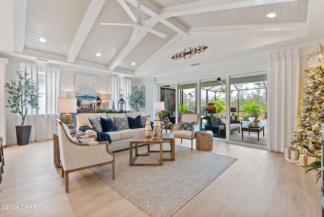 living room with beam ceiling, light hardwood / wood-style floors, high vaulted ceiling, and ceiling fan