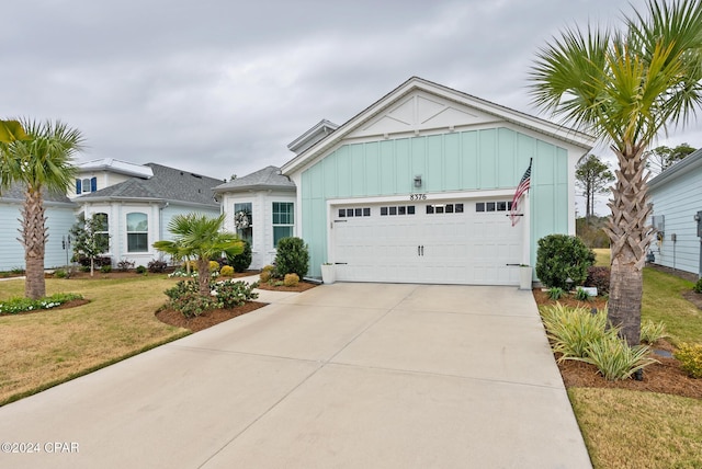 view of front of house with a front lawn and a garage