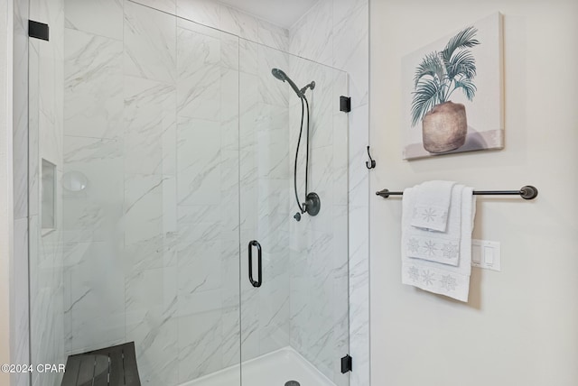 bathroom with an enclosed shower