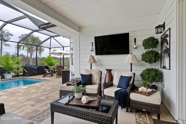 view of patio featuring an outdoor living space, grilling area, and a lanai