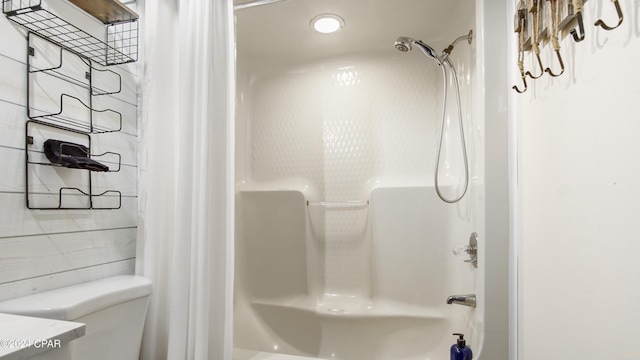 full bathroom featuring vanity, shower / tub combo, and toilet