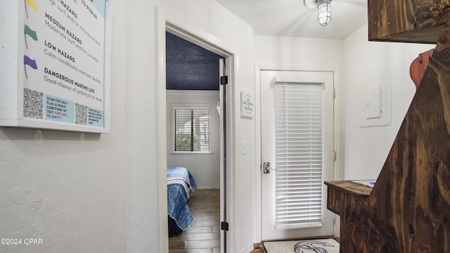 hallway with wood-type flooring