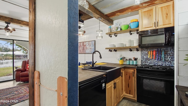 kitchen with beamed ceiling, sink, black appliances, and backsplash