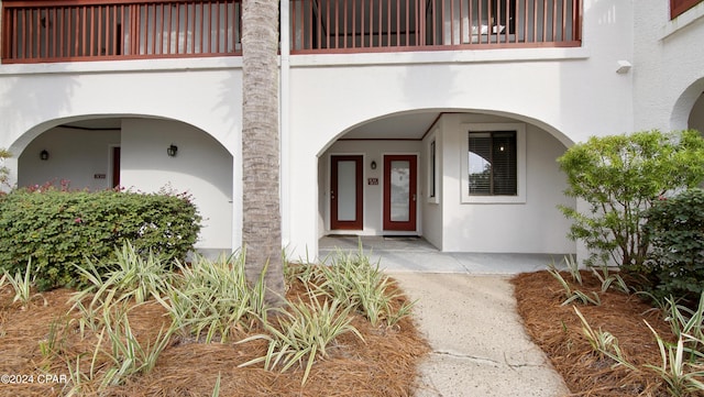 entrance to property with a balcony