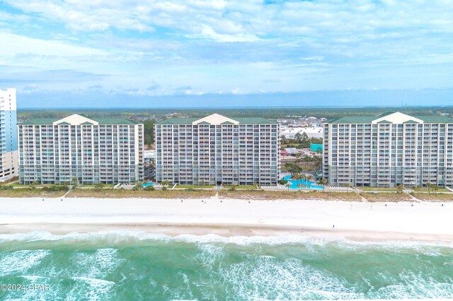 bird's eye view featuring a beach view and a water view