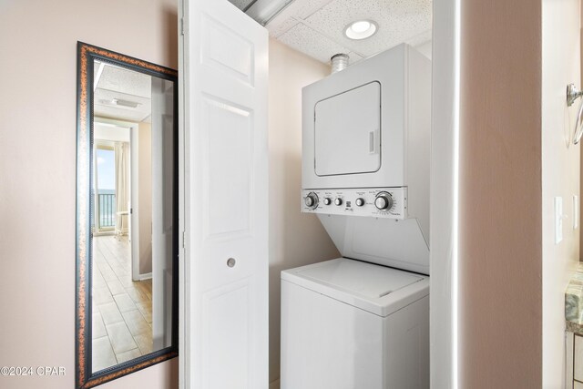 clothes washing area with stacked washer / drying machine