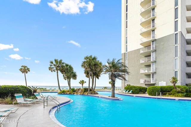 view of pool with a water view