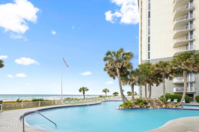 view of pool featuring a water view