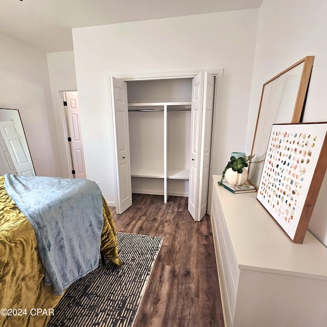 bedroom with a closet and dark wood-type flooring