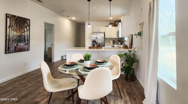 dining area with dark wood-type flooring