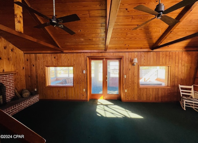 carpeted living room with vaulted ceiling with beams, ceiling fan, and wood ceiling