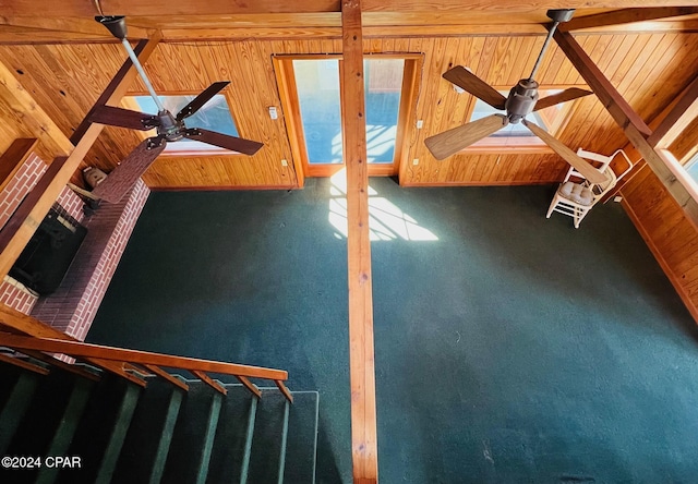 unfurnished living room with ceiling fan