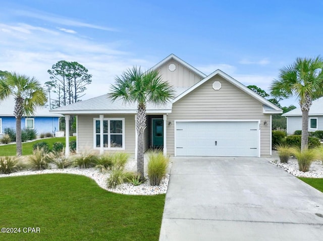 ranch-style home with a garage and a front lawn