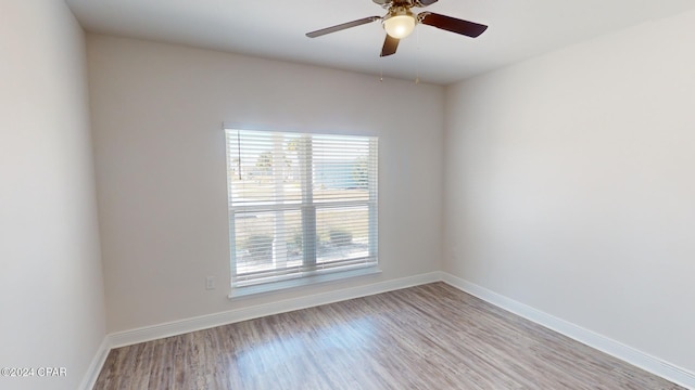 unfurnished room with light hardwood / wood-style flooring and ceiling fan