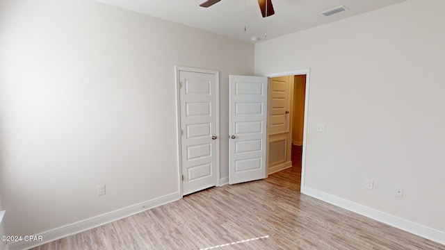 unfurnished bedroom featuring ceiling fan and light hardwood / wood-style floors